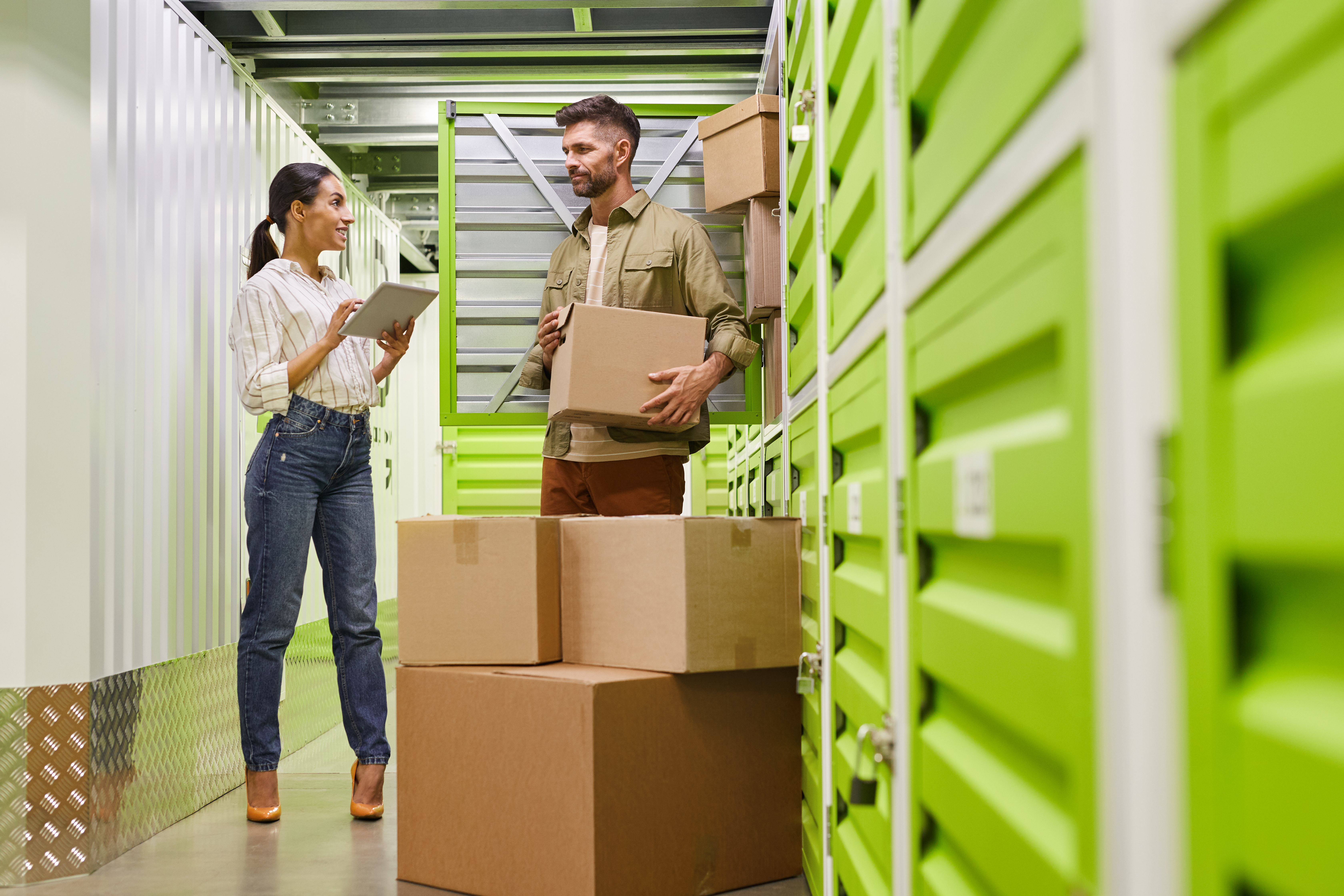 Couple with boxes at a storage facility